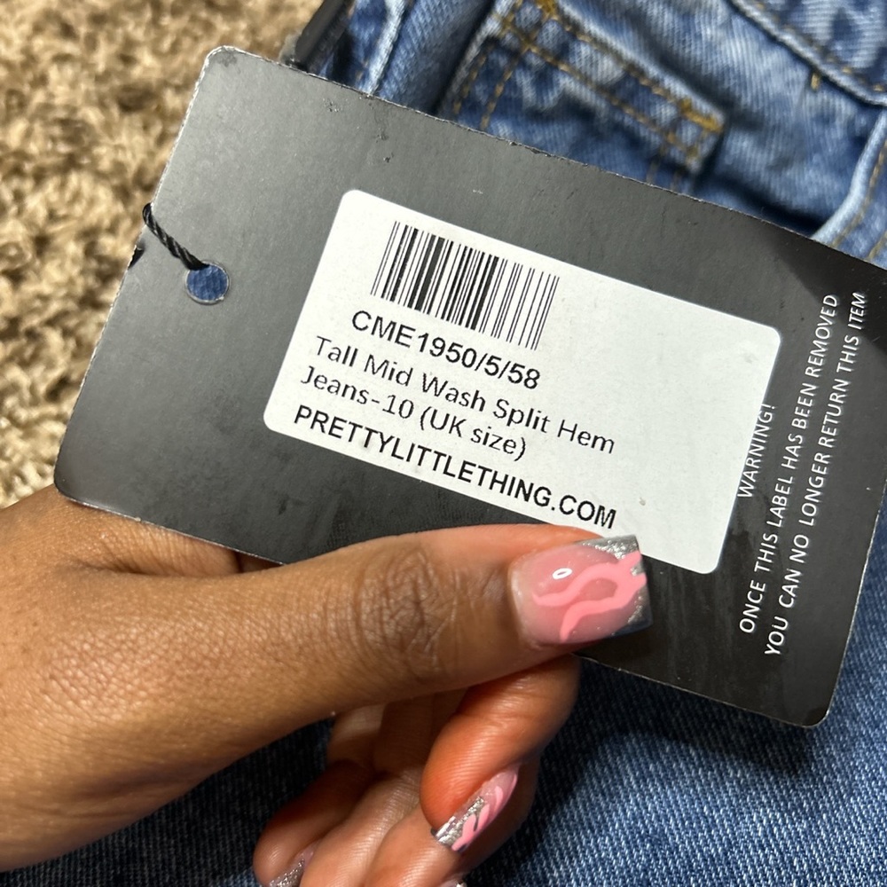 Mid wash split hem jeans from pretty little things.